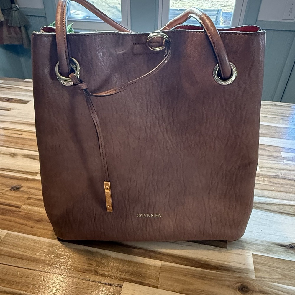 Calvin Klein Brown Shoulder Tote Bag Gold Hardware Drawstring Closure Red Lining